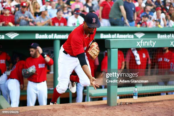 Xander Bogaerts of the Boston Red Sox tosses dirt outside of the dugout before a game against the Toronto Blue Jays at Fenway Park on July 13, 2018...