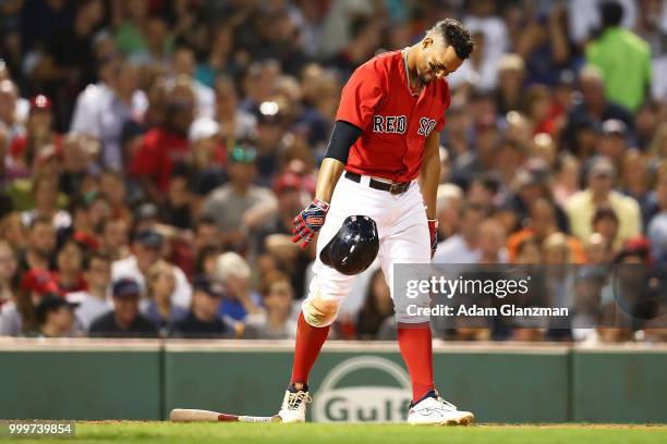 Mookie Betts of the Boston Red Sox reacts after striking out in the fifth inning of a game against the Toronto Blue Jays at Fenway Park on July 13,...