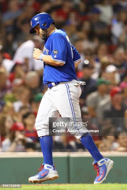 Kendrys Morales of the Toronto Blue Jays crosses home plate as he scores a run in the eighth inning of a game against the Boston Red Sox at Fenway...