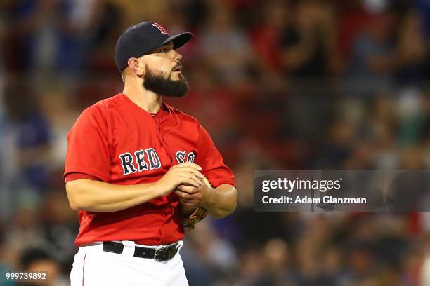 Robby Scott of the Boston Red Sox looks on after giving up a two-run home run in the ninth inning of a game against the Toronto Blue Jays at Fenway...