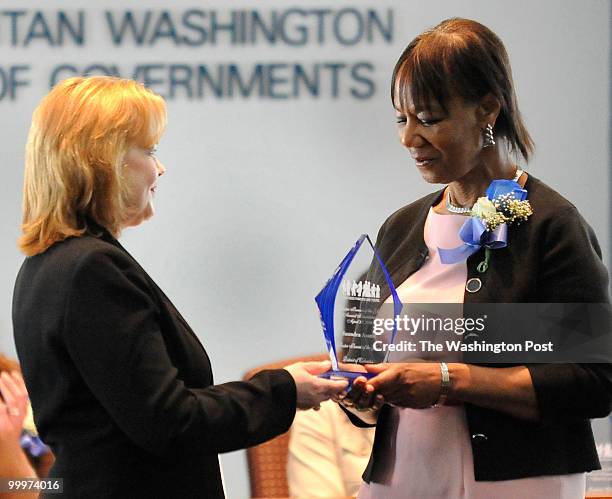 Margaret Meiers, Vice President of the Freddie Mac Foundation presented Saundra Asante with the District of Columbia Foster Parent of the Year award...