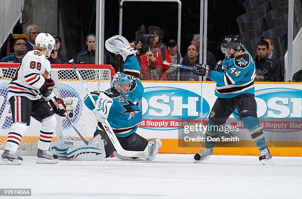 Evgeni Nabokov of the San Jose Sharks makes a glove save in Game Two of the Western Conference Finals during the 2010 NHL Stanley Cup Playoffs vs the...