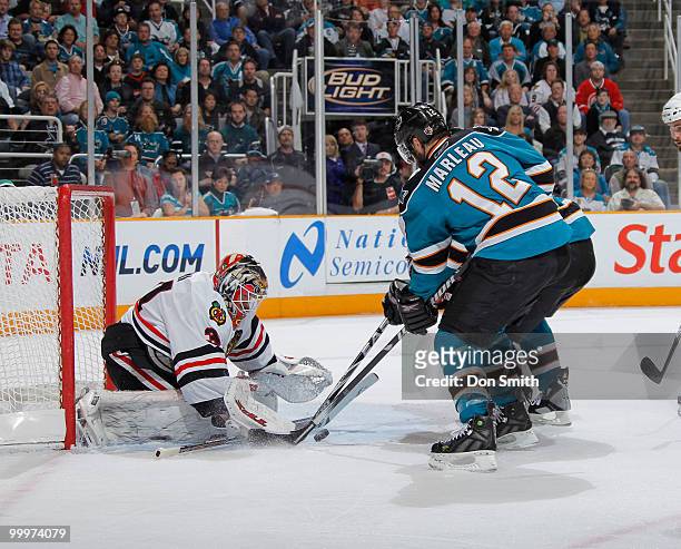 Antti Niemi of the Chicago Blackhawks, makes a save on Patrick Marleau of the San Jose Sharks in Game Two of the Western Conference Finals during the...