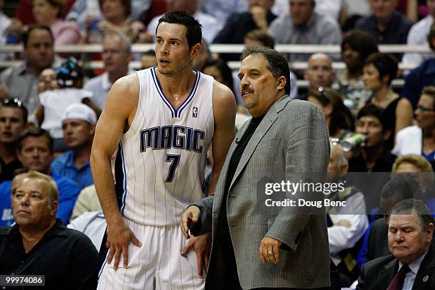 Head coach Stan Van Gundy of the Orlando Magic talks with J.J. Redick on the bench against the Boston Celtics in Game Two of the Eastern Conference...