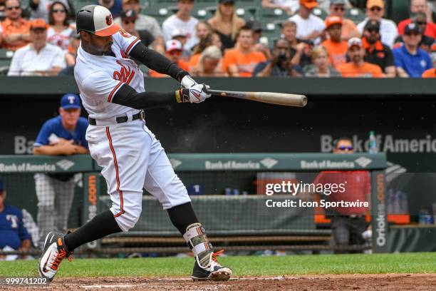 Baltimore Orioles center fielder Adam Jones hits an RBI double in the third inning during the game between the Texas Rangers and the Baltimore...