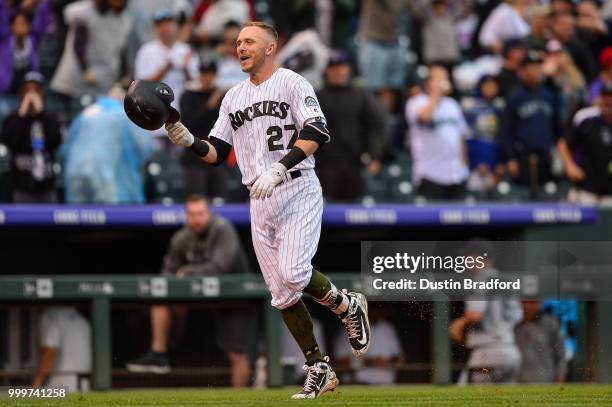 Trevor Story of the Colorado Rockies celebrates on the base paths after hitting a ninth-inning, walk-off home run against the Seattle Mariners at...