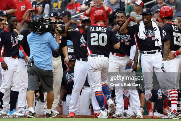 Peter Alonso of the New York Mets and the U.S. Team celebrates after scoring a two-run home run in the seventh inning against the World Team during...