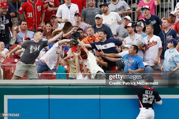 Buddy Reed of the San Diego Padres and the U.S. Team cannot make a catch on a home run hits a by Yusniel Diaz of the Los Angeles Dodgers and the...