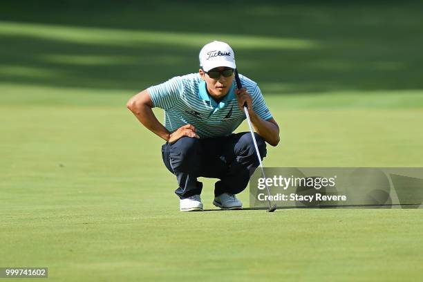 Michael Kim lines up a putt on the 18th green during the final round of the John Deere Classic at TPC Deere Run on July 15, 2018 in Silvis, Illinois.