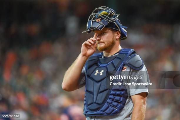 Detroit Tigers catcher John Hicks looks to the dugout for a signal during the baseball game between the Detroit Tigers and the Houston Astros on July...