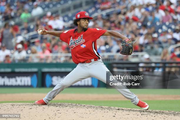 Adonis Medina of the World Team pitches in the seventh inning against the U.S. Team during the SiriusXM All-Star Futures Game at Nationals Park on...