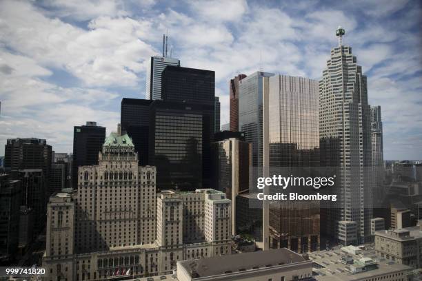 Building, right, stands in the financial district of Toronto, Ontario, Canada, on Wednesday, July 11, 2018. Canadian stocks were mixed Friday as...