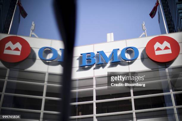 Bank of Montreal sign is reflected on a surface in the financial district of Toronto, Ontario, Canada, on Wednesday, July 11, 2018. Canadian stocks...