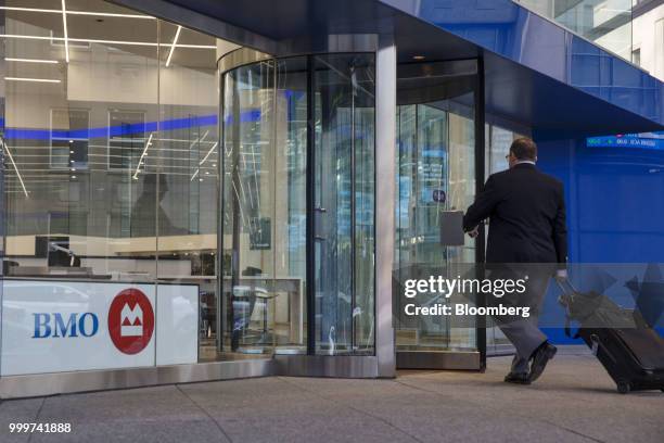 Man enters a Bank of Montreal branch in the financial district of Toronto, Ontario, Canada, on Wednesday, July 11, 2018. Canadian stocks were mixed...