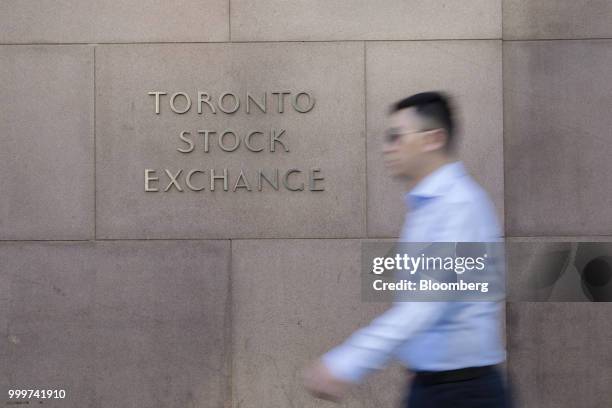 Pedestrian walks past the Toronto Stock Exchange in the financial district of Toronto, Ontario, Canada, on Wednesday, July 11, 2018. Canadian stocks...