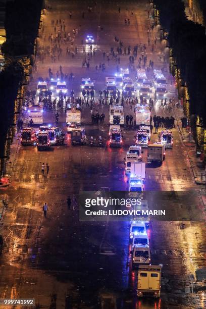 Police dispers people with water canons after celebrations following the Russia 2018 World Cup final football match between France and Croatia, on...
