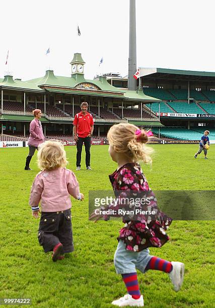 Brett Kirk of the Swans stands on the ground with his wife Hayley and childen after announcing his retirement at the end of the 2010 AFL season...