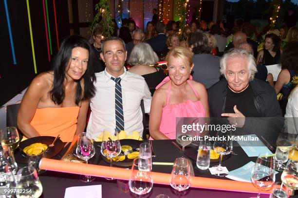 Kim Heirston Evans, Eric Freeman, Janna Bullock and Tony Shafrazi attend the Parrish Art Museum Midsummer Party 2018 at Parrish Art Museum on July...