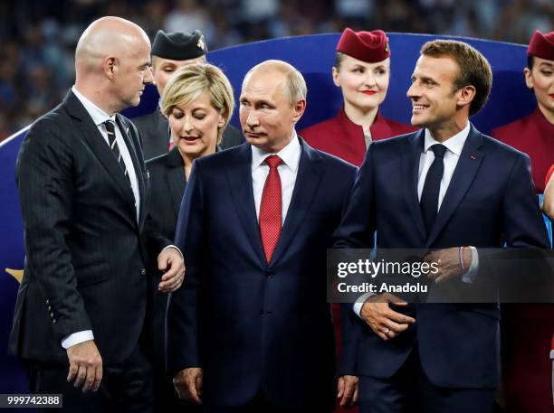 Russian President Vladimir Putin , FIFA President Gianni Infantino and French President Emmanuel Macron attend the award ceremony of the 2018 FIFA...