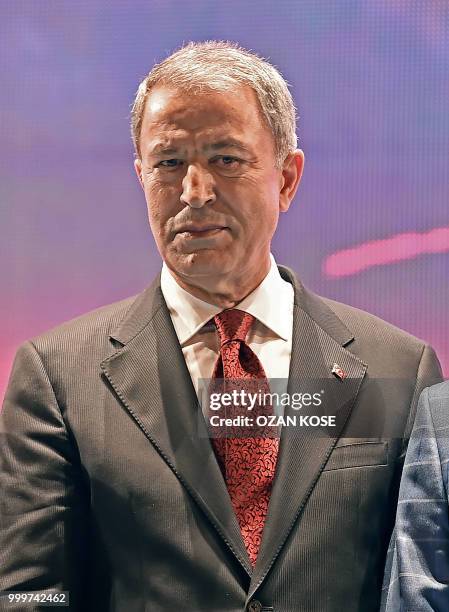 Former General in Chief of Turkish Army ,newly defend minister Hulusi Akar arrives to stage as Turkey's President Recep Tayyip Erdogan delivers a...