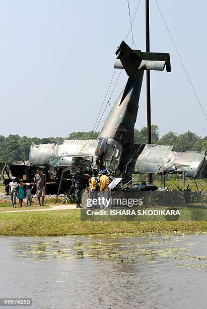 By Mel Gunasekera In this picture taken on November 11 visitors inspect a Czech-built Zlin 143 light aircraft flown by Tamil Tiger rebels on display...