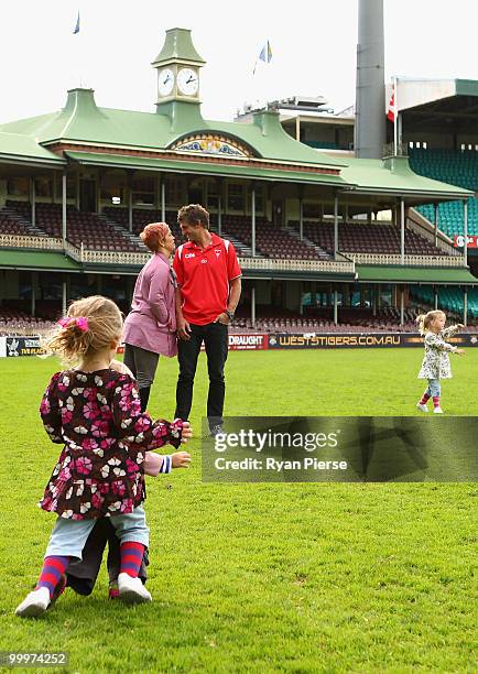 Brett Kirk of the Swans stands on the ground with his wife Hayley and childen after announcing his retirement at the end of the 2010 AFL season...