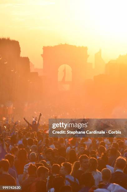 Fans celebrate the Victory of France in the World Cup 2018, on the Champs Elysees on July 15, 2018 in Paris, France.