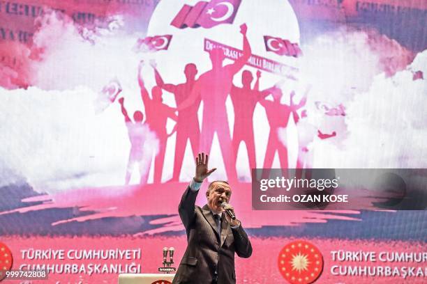 Turkey's President Recep Tayyip Erdogan delivers a speech at a ceremony site on "July 15 Martyrs Bridge" in Istanbul on July 15, 2018. - Turkey is...
