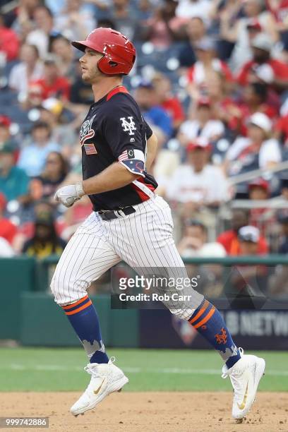 Peter Alonso of the New York Mets and the U.S. Team rounds the bases after scoring a two-run home run in the seventh inning against the World Team...
