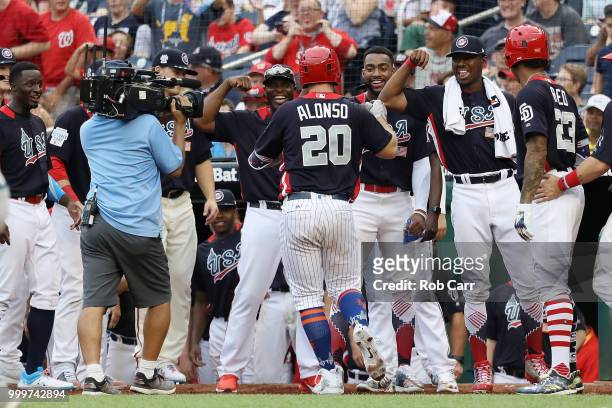 Peter Alonso of the New York Mets and the U.S. Team celebrates after scoring a two-run home run in the seventh inning against the World Team during...