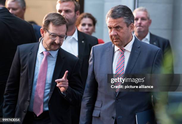 German Foreign Minister Sigmar Gabriel speaks with the new OSCE general secretary Thomas Greminger at the opening of the international conference...