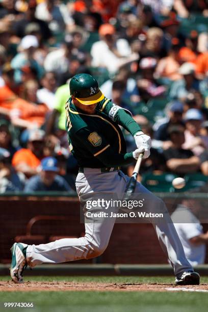 Stephen Piscotty of the Oakland Athletics hits a home run against the San Francisco Giants during the sixth inning at AT&T Park on July 15, 2018 in...