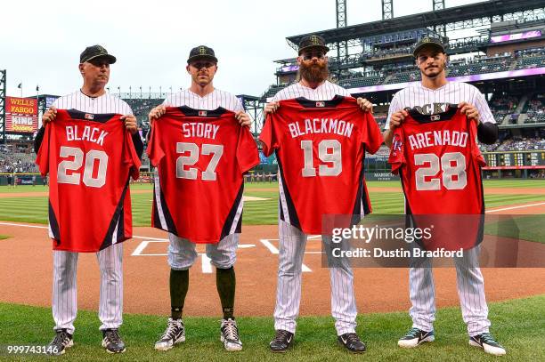 All-Star team representatives of the Colorado Rockies manager Bud Black, Trevor Story, Charlie Blackmon and Nolan Arenado stand with their jerseys...