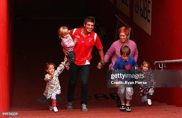 Brett Kirk of the Swans walks onto the ground with his wife Hayley and children Indhi, Memphys, Tallulah,and Sadie after announcing his retirement at...