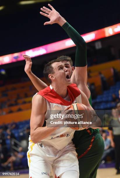 Johannes Voigtmann of Germany in action against Jonas Valanciunas of Lithuania during the EuroBasket 2017 Group B game between the Lithuania and...