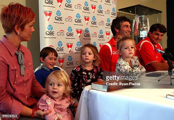 Brett Kirk of the Swans speaks to the media with his wife Hayley and children Indhi, Memphys, Tallulah,and Sadie, and Paul Roos, coach of the Swans...