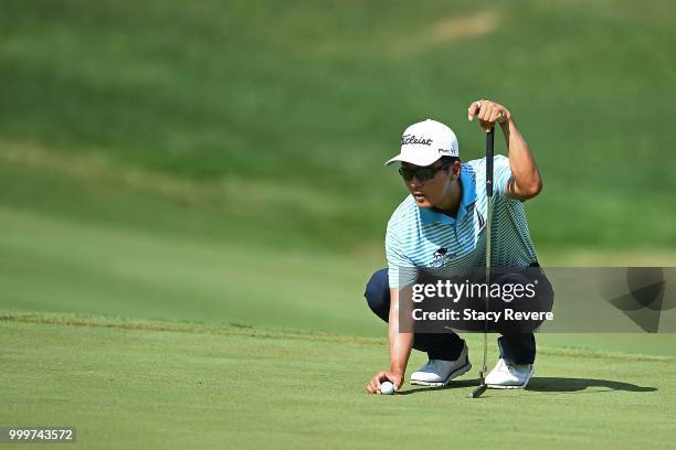 Michael Kim lines up a putt on the 14th green during the final round of the John Deere Classic at TPC Deere Run on July 15, 2018 in Silvis, Illinois.