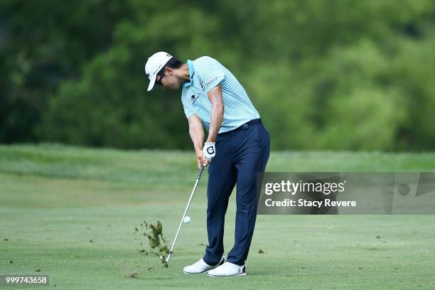 Michael Kim hits his approach shot on the 15th hole during the final round of the John Deere Classic at TPC Deere Run on July 15, 2018 in Silvis,...