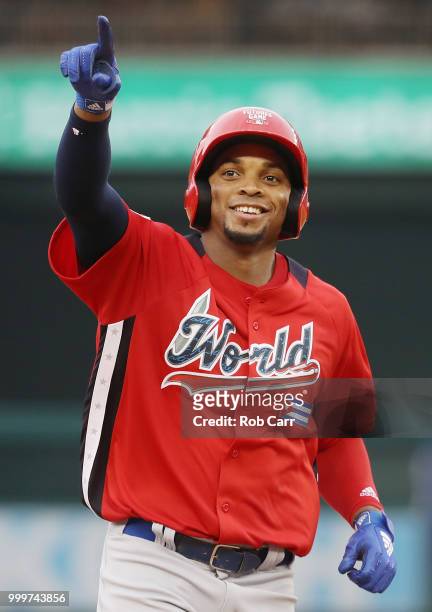 Yusniel Diaz of the Los Angeles Dodgers and the World Team celebrates after hitting a solo home run in the seventh inning against the U.S. Team...
