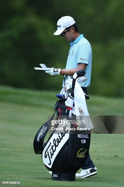 Michael Kim waits to hit his second shot on the 15th hole during the final round of the John Deere Classic at TPC Deere Run on July 15, 2018 in...