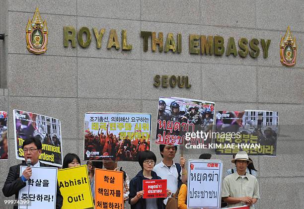 South Korean rights activists hold pickets in front of the Thai embassy in Seoul on May 19 demanding the Thai government should stop crackdowns on...