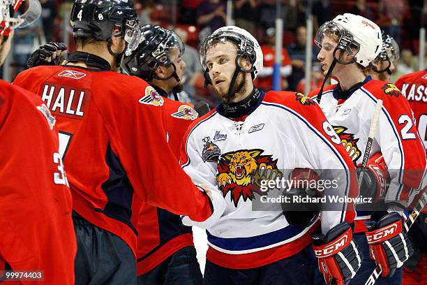 Kelsey Tessier of the Moncton Wildcats shakes hands with Taylor Hall of the Windsor Spitfires after being eliminated from the 2010 Mastercard...