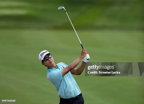 Michael Kim hits a shot on the 13th hole during the final round of the John Deere Classic at TPC Deere Run on July 15, 2018 in Silvis, Illinois.
