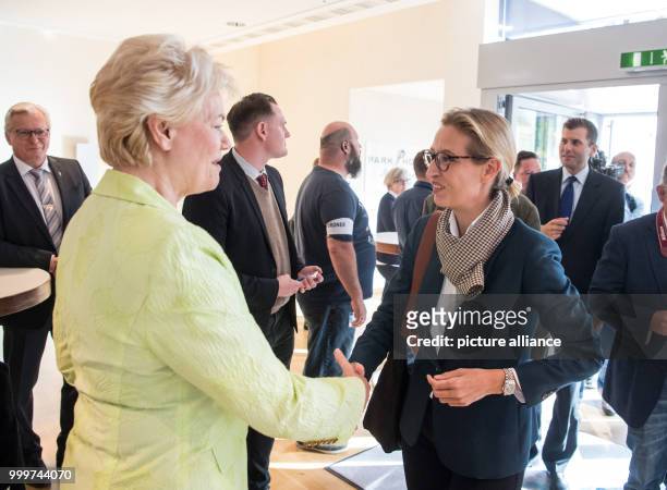 Erika Steinbach , member of the parliament and Alice Weidel, AfD top-candidate, shake hands at an AfD election campaign event in Pforzheim, Germany,...