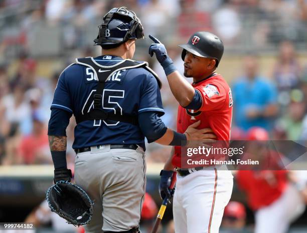 Jesus Sucre of the Tampa Bay Rays gets between Eduardo Escobar of the Minnesota Twins and Diego Castillo of the Tampa Bay Rays as the benches cleared...