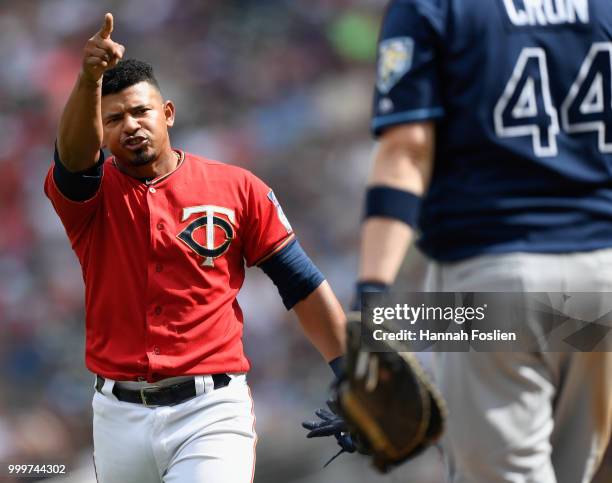 Cron of the Tampa Bay Rays looks on as Eduardo Escobar of the Minnesota Twins yells after the seventh inning of the game causing the benches to clear...