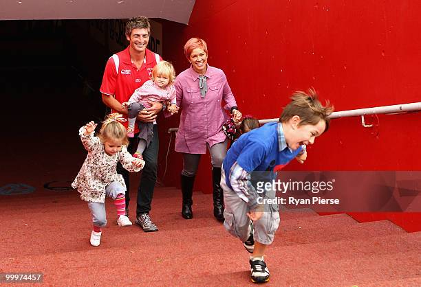Brett Kirk of the Swans walks onto the ground with his wife Hayley and children Indhi, Memphys, Tallulah,and Sadie after announcing his retirement at...