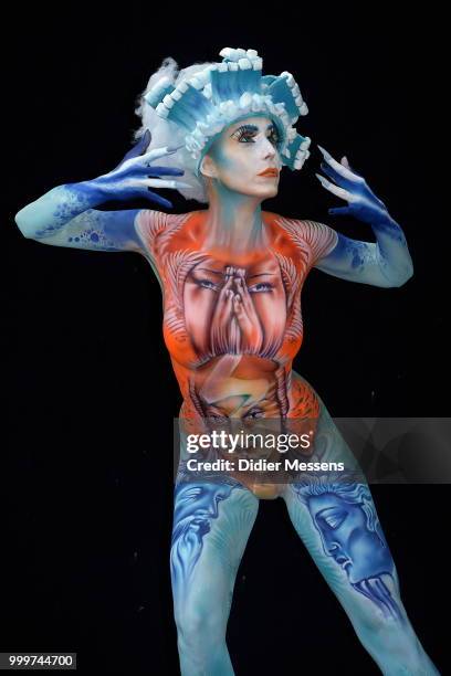 Model, painted by bodypainting artist Benoit Botella from Guadeloupe, poses for a picture at the 21st World Bodypainting Festival 2018 on July 14,...