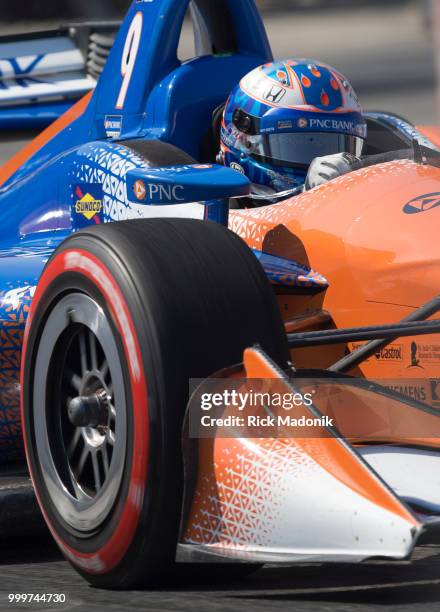 Scott Dixon, of New Zealand, makes his way through the back of the course. He would go on to take the checkered flag at Honda Indy Toronto race at...