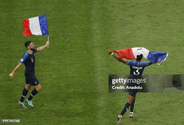 Presnel Kimpembe and Oliver Giroud of France celebrate after winning the 2018 FIFA World Cup Russia final between France and Croatia at the Luzhniki...